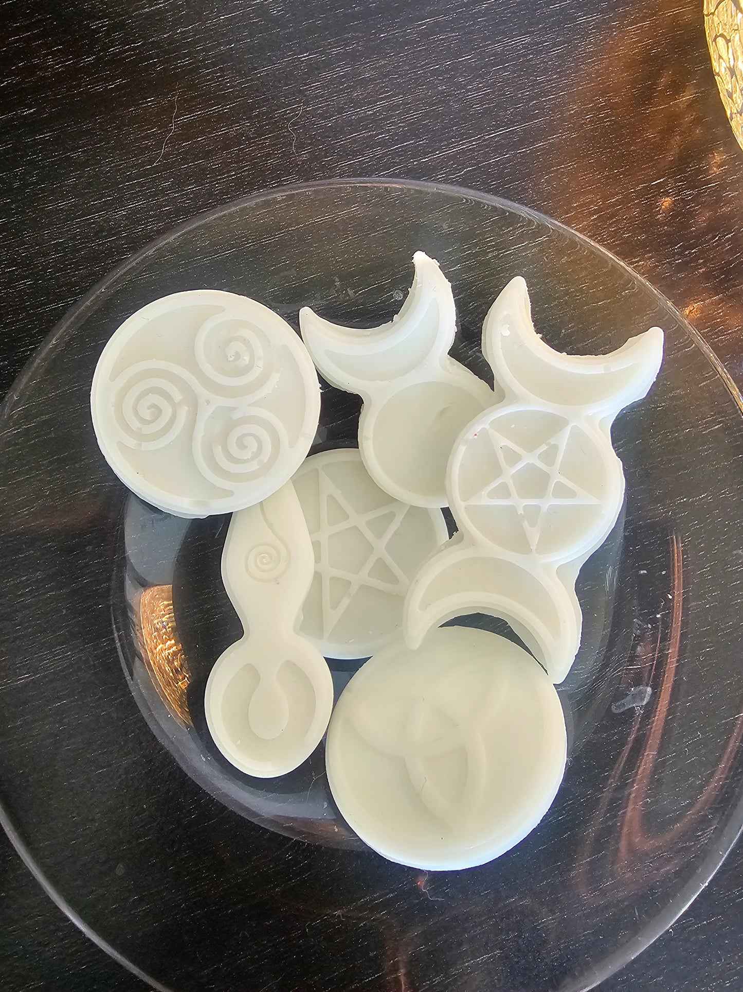 White scented witchy aesthetic wax melts on  glass plate